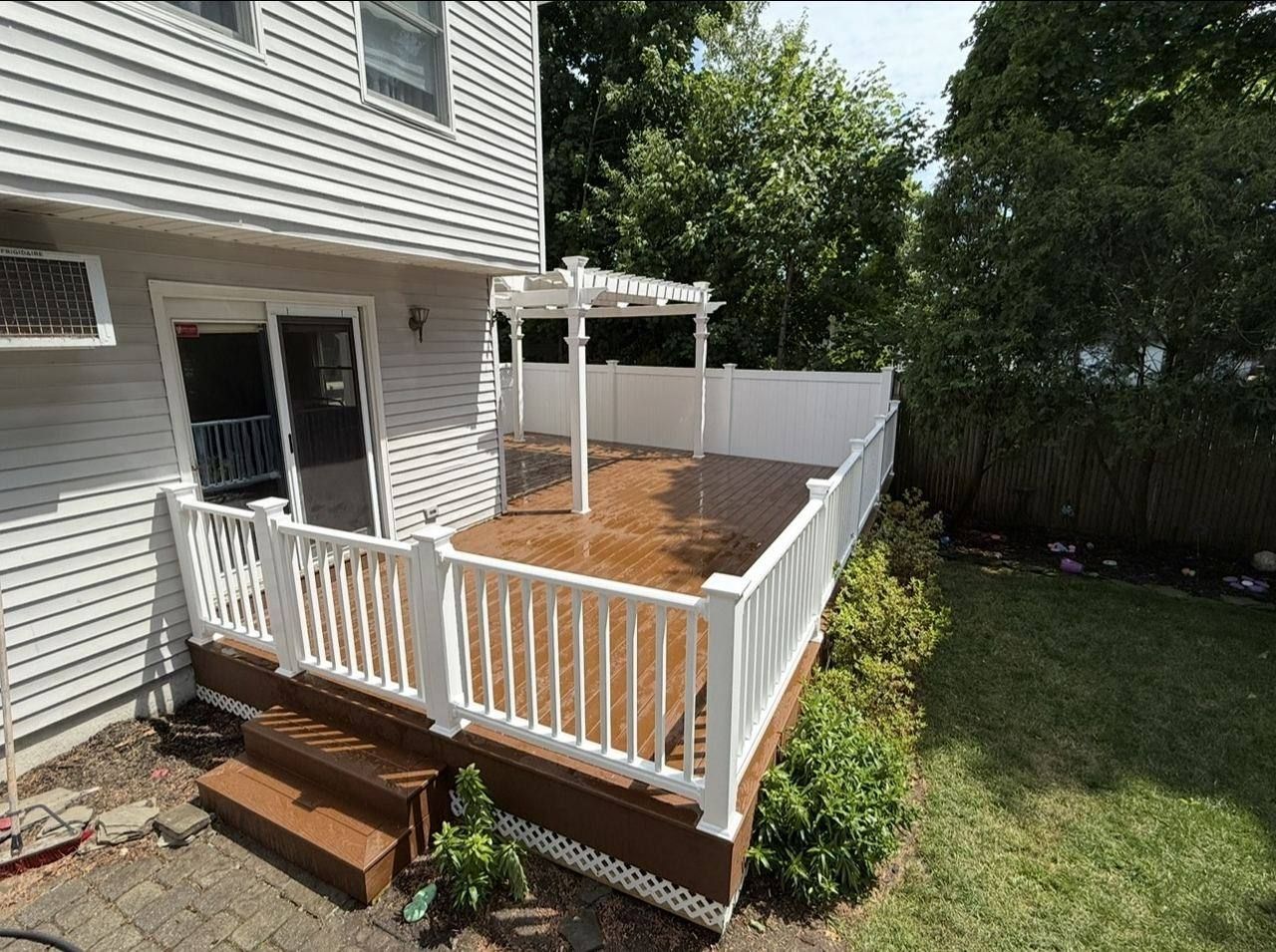 New composite deck with railing and pergola - after