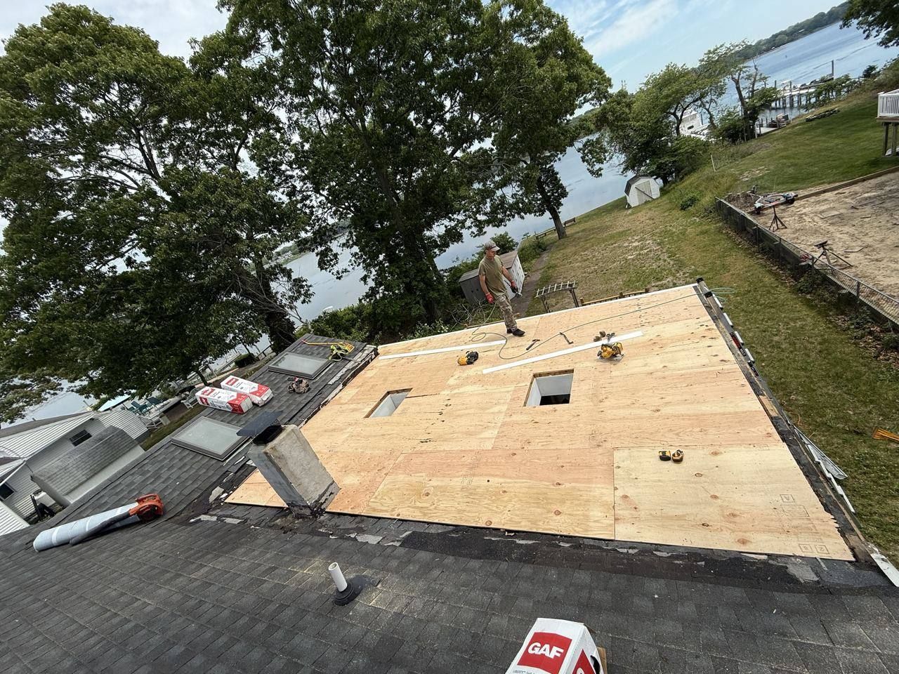 Waterfront home: new decking and flat roof section - in progress